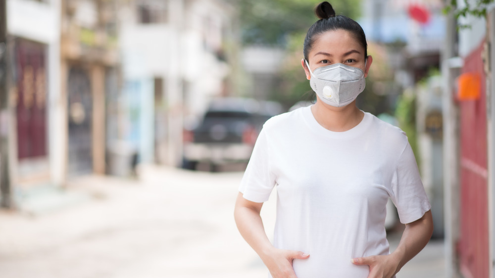 pregnant woman wearing mask