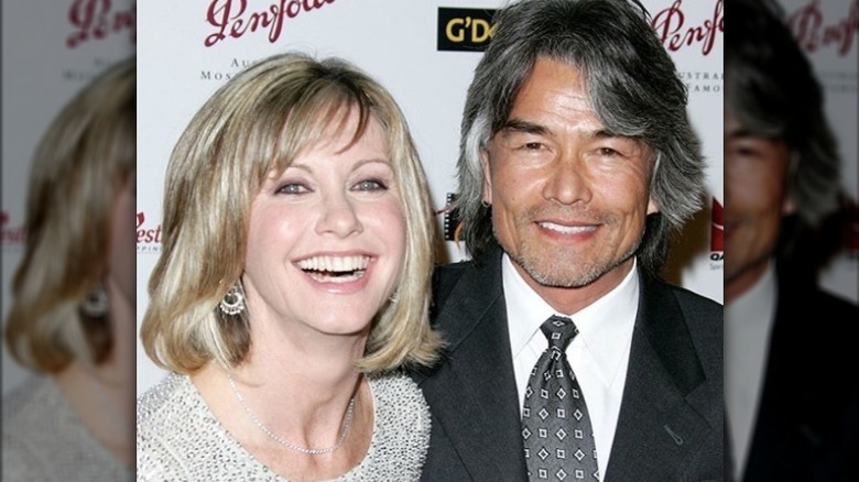 Patrick Kim McDermott posing with Olivia Newton-John