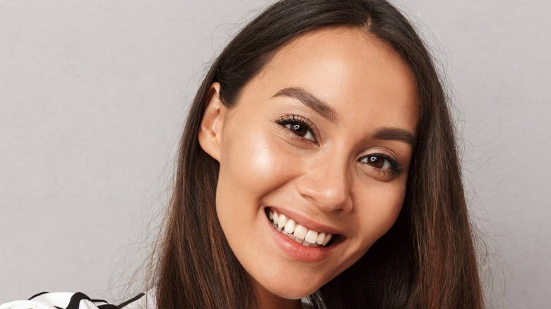 Woman showing off bright smile in her selfie