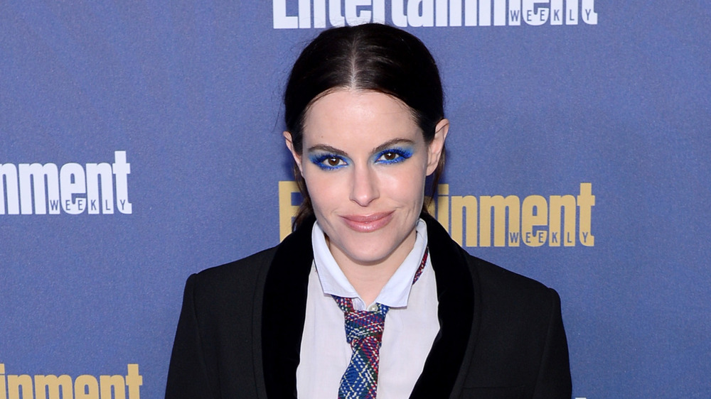 Emily Hampshire wearing blue eyeshadow