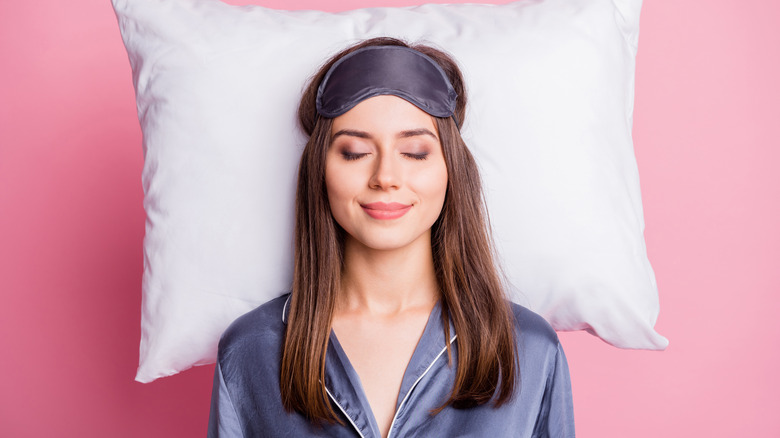Woman sleeping with silk mask