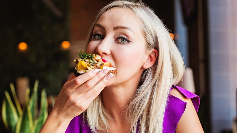 Woman eating Danish food