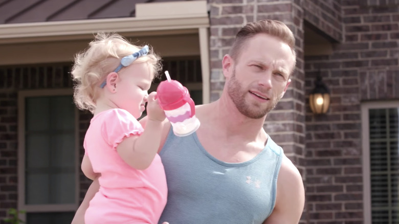 Riley, one of the quints on OutDaughtered, and dad Adam Busby