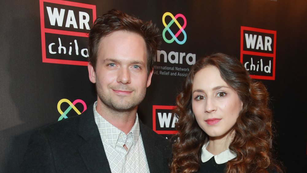 Troian Bellisario and Patrick J. Adams at a comedy event in 2019