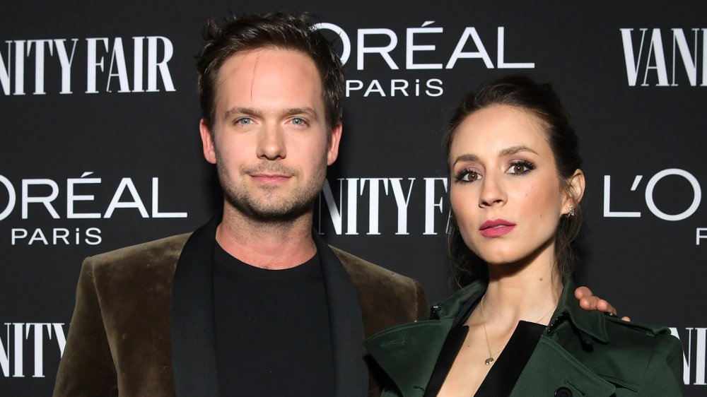 Troian Bellisario and Patrick J. Adams at a Vanity Fair event in 2019