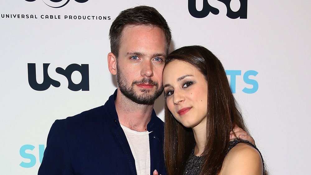 Troian Bellisario and Patrick J. Adams at a Suits event in 2016