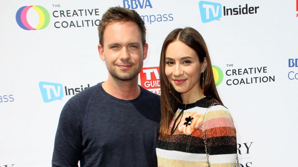 Troian Bellisario and Patrick J. Adams at an awards show in 2017