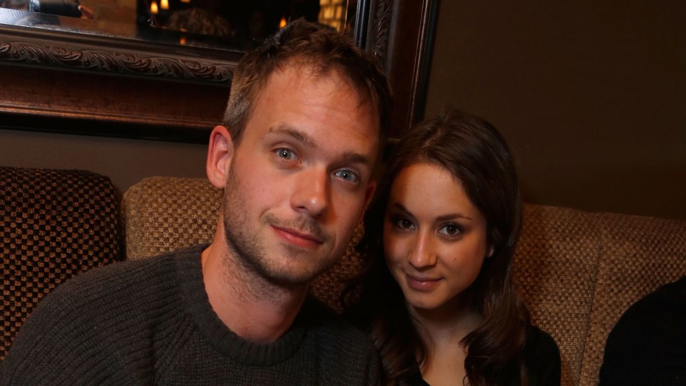 Troian Bellisario and Patrick J. Adams at a restaurant