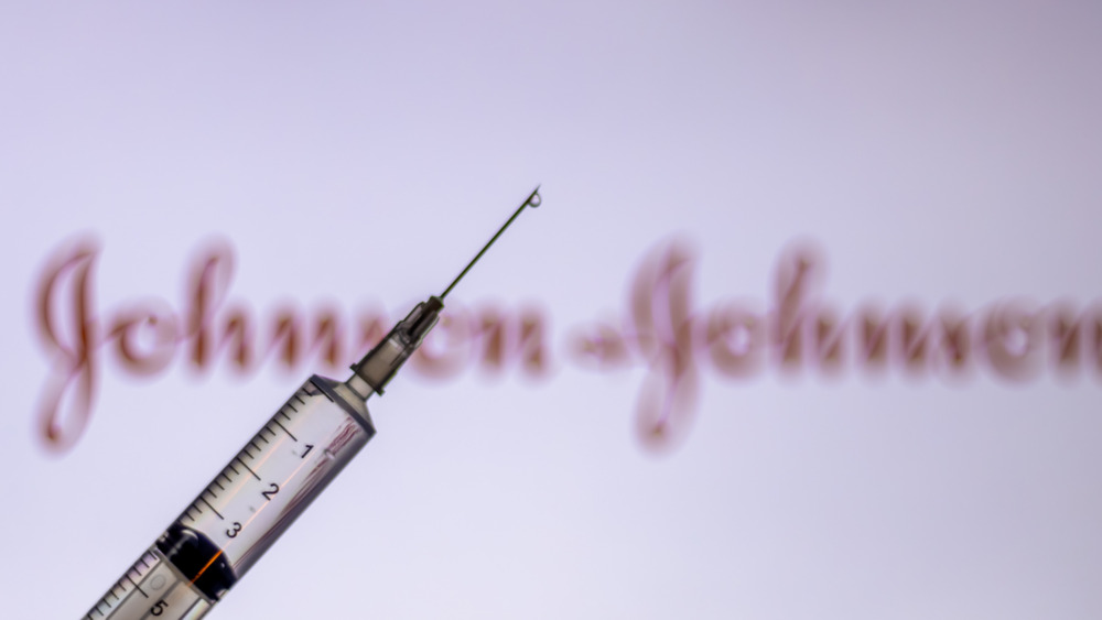 Vaccine with J&J logo in the background