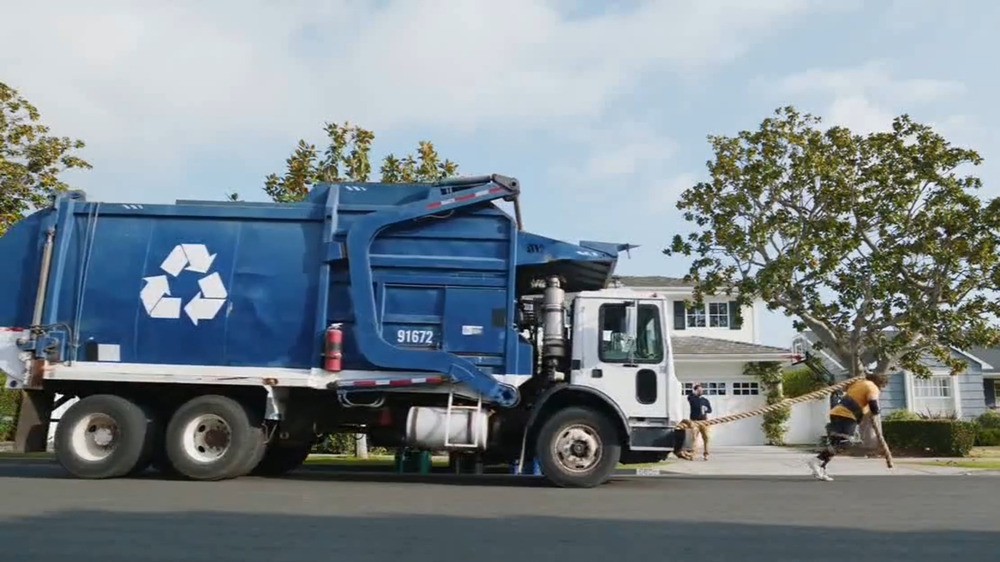 The Strong Man In GEICO's World's Strongest Man Commercial drags a truck