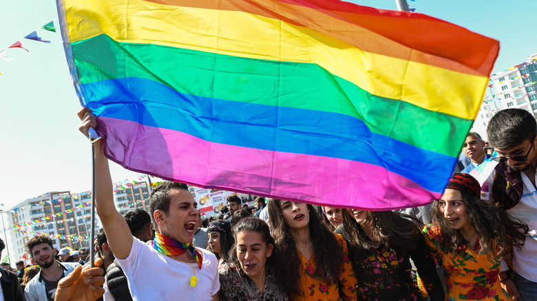 Marchers waving the Pride flag