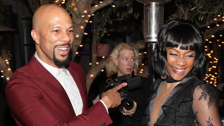 Tiffany Haddish and Common celebrating