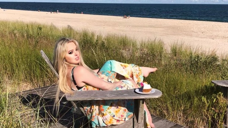 Tiffany Trump sitting on the beach