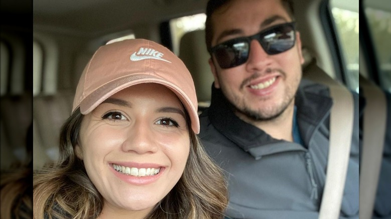 Jason and Justina smiling in a selfie