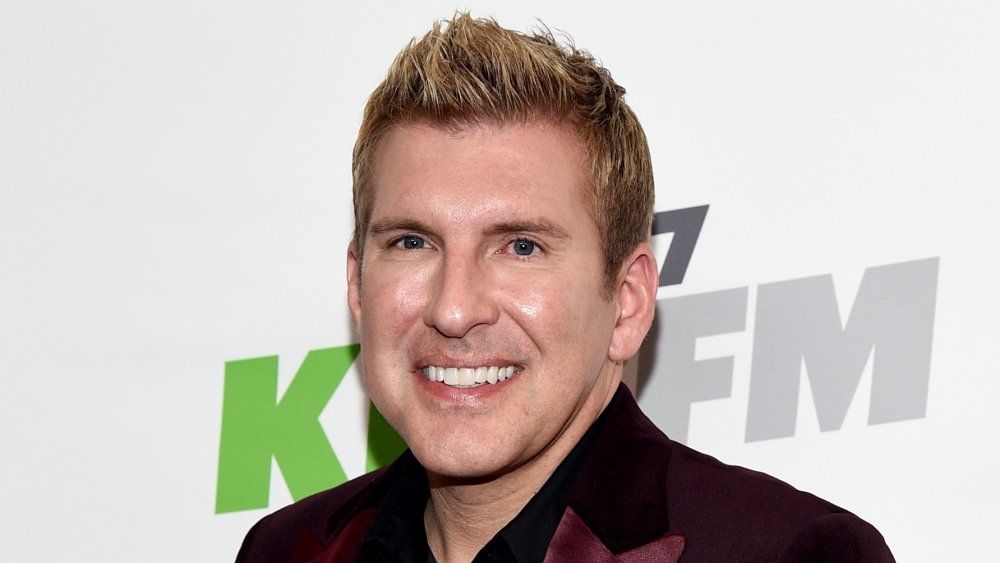 Todd Chrisley at a red carpet event, smiling