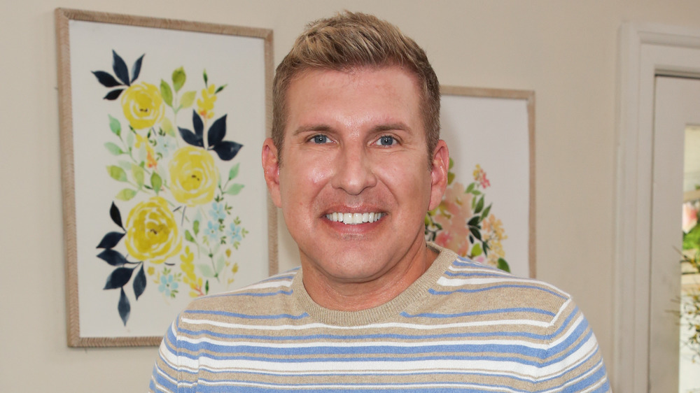 Todd Chrisley smiling from home