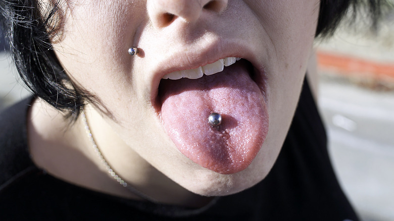 Tongue piercing and upper lip piercing 