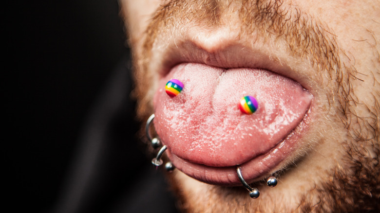 LGBTQ flag tongue piercing with beard 