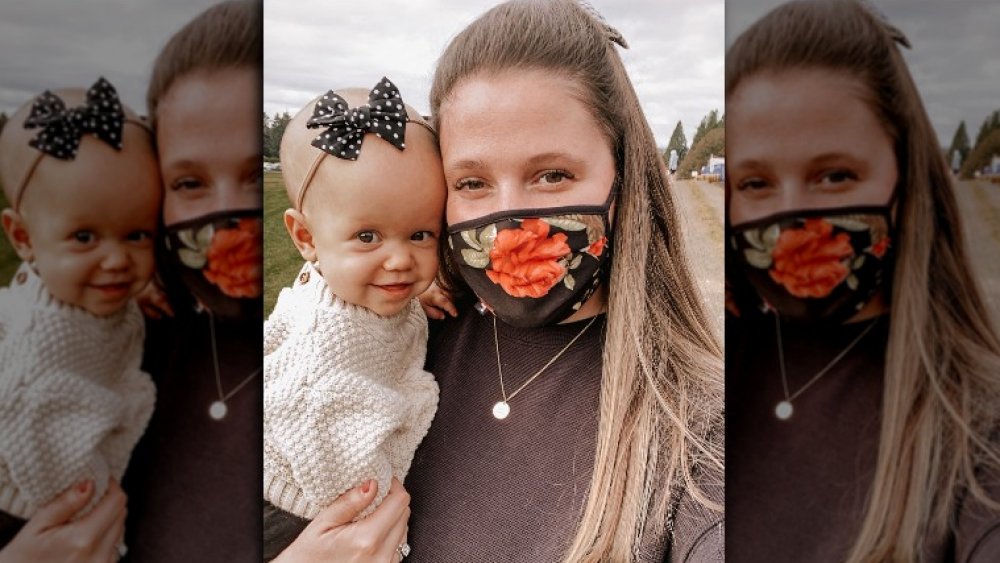 Tori Roloff with her baby, wearing a mask