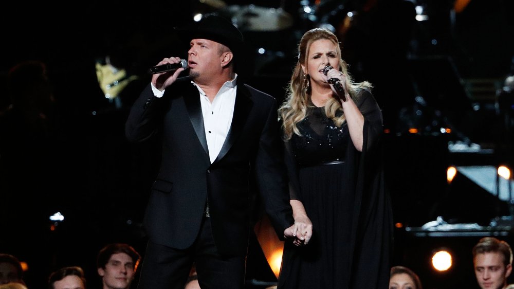 Garth Brooks and Trisha Yearwood perform onstage during the 50th annual CMA Awards in 2016