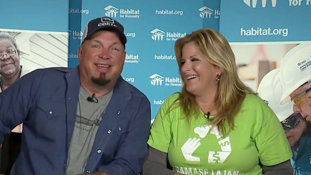 Trisha Yearwood and Garth Brooks giving an interview