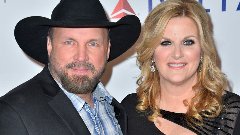 Trisha Yearwood and Garth Brooks smile together