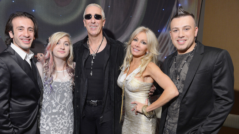 Dee Snider and wife Suzette pose with three of their four children