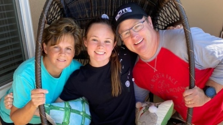 Mariah Bell and parents smiling