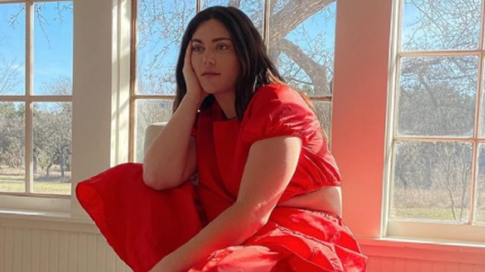  Ali Tate-Cutler posing in red outfit