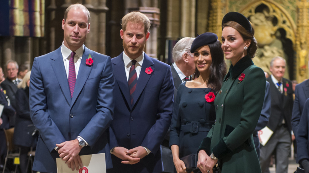 Prince William, Prince Harry, Meghan Markle, and Kate Middleton standing