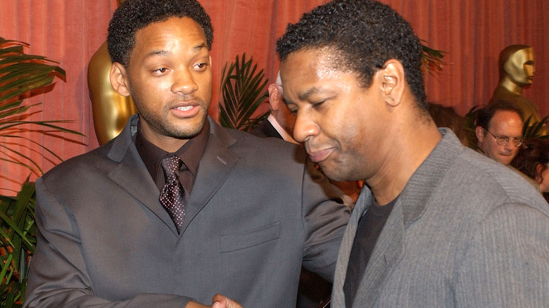 Will Smith and Denzel Washington shaking hands