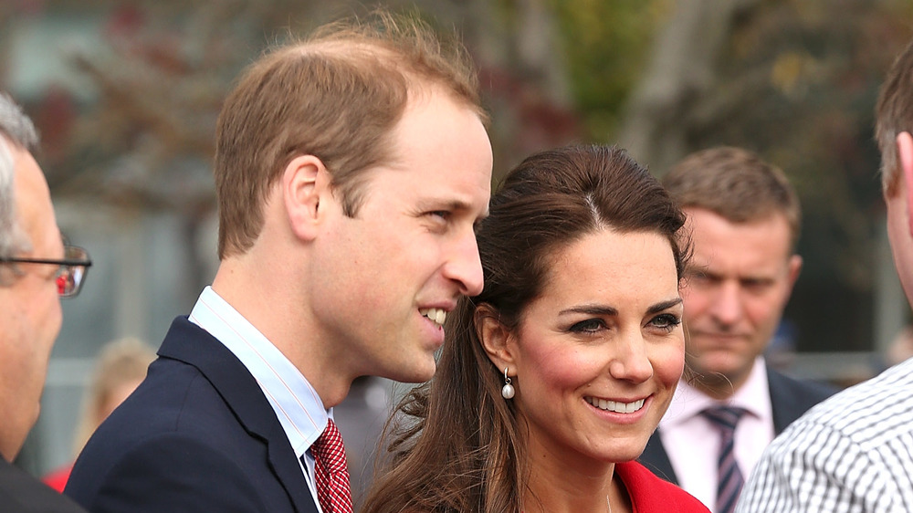 Prince Harry and Kate Middleton greeting people