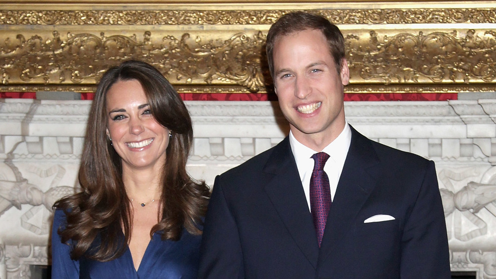 Kate Middleton and Prince William in front of a mantle