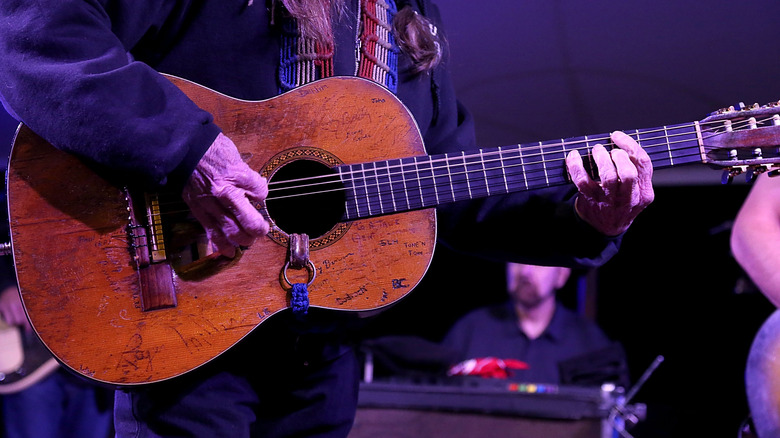 Willie Nelson with his guitar, Trigger