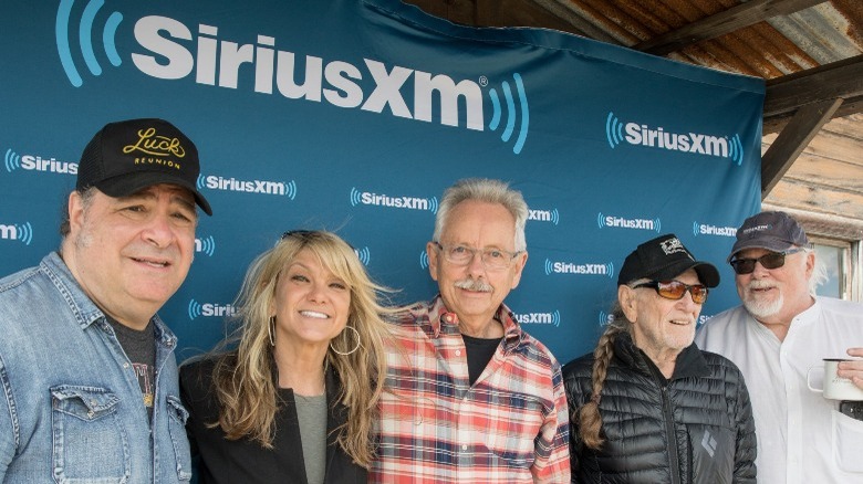 Paula and Willie Nelson with band