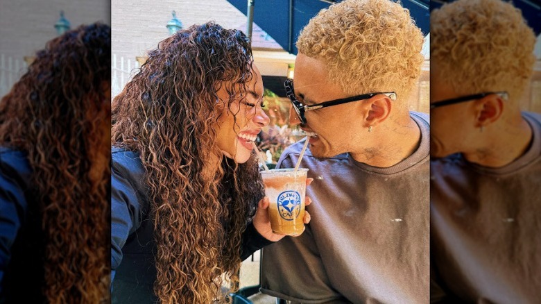 Winnie Harlow and Kyle Kuzma sharing a drink