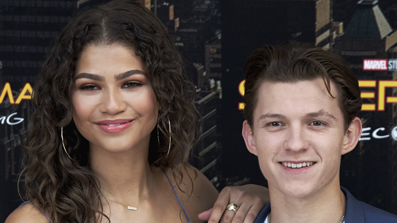 Zendaya and Tom Holland posing, smiling