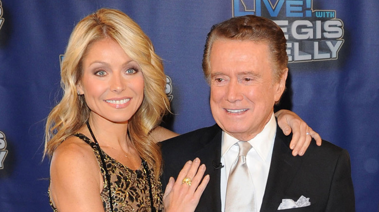 Kelly Ripa embraces Regis Philbin 