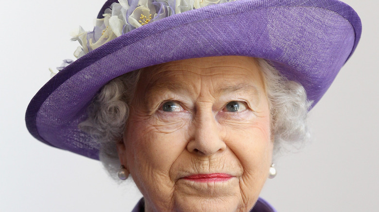 Queen Elizabeth in purple. 