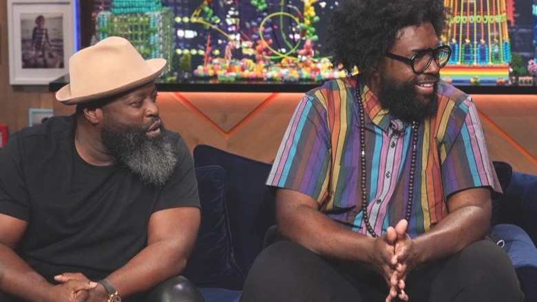 Black Thought and Questlove of The Roots sitting together on a couch on The Kids Tonight Show