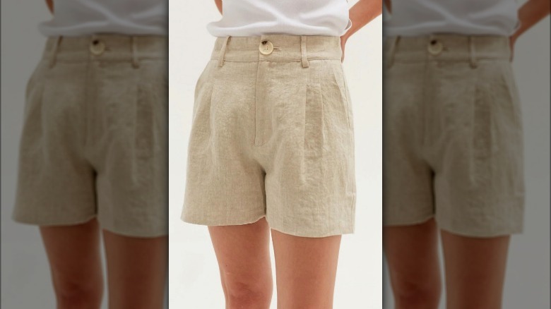 Model wearing khaki linen shorts