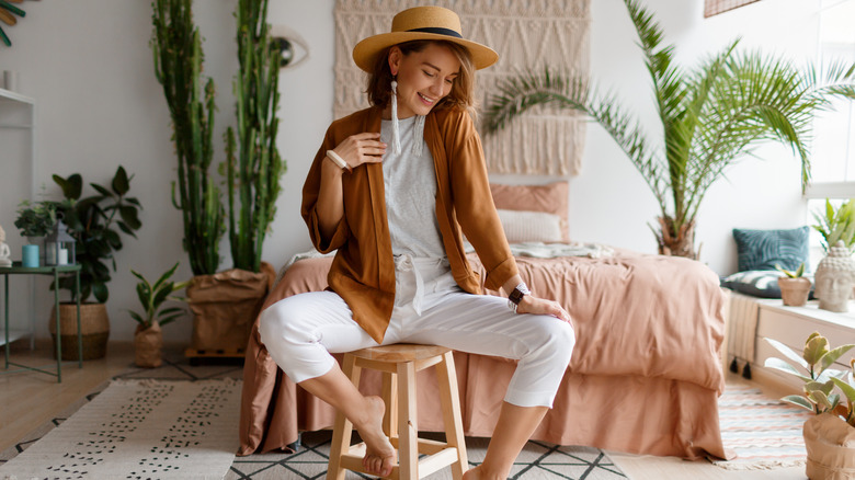 Woman in straw hat and cozy sweater