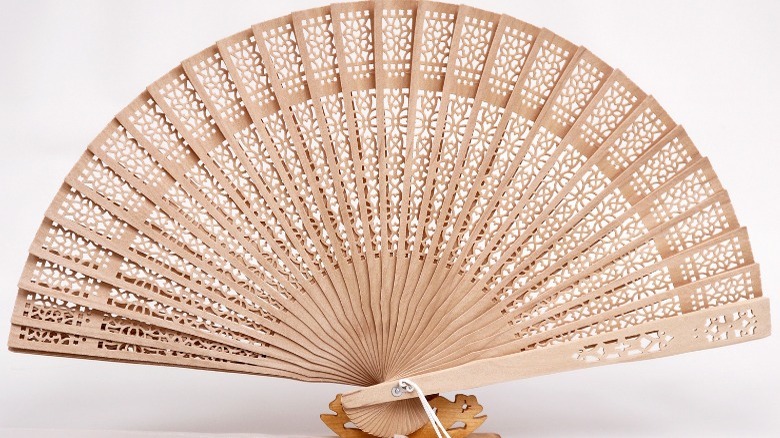 Carved wooden fan