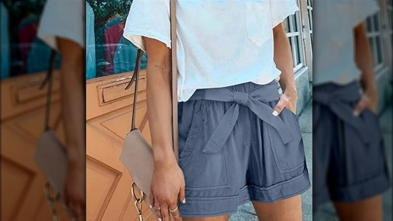 Model wearing blue tie-front shorts