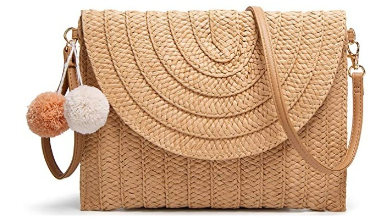 Small straw handbag with pompom accent