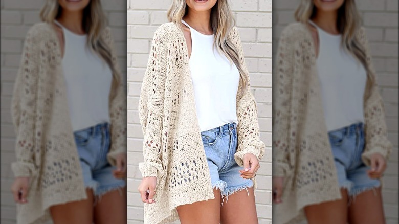 Model wearing loose weave cream cardigan