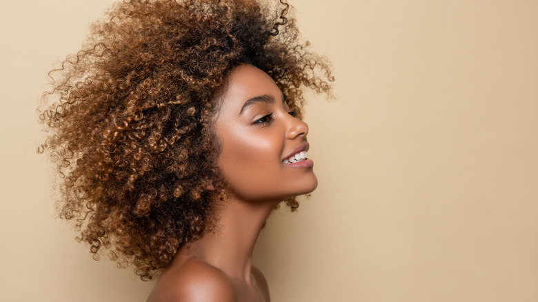 Woman with curly hair smiling