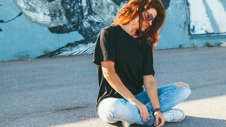 Woman sitting on the ground