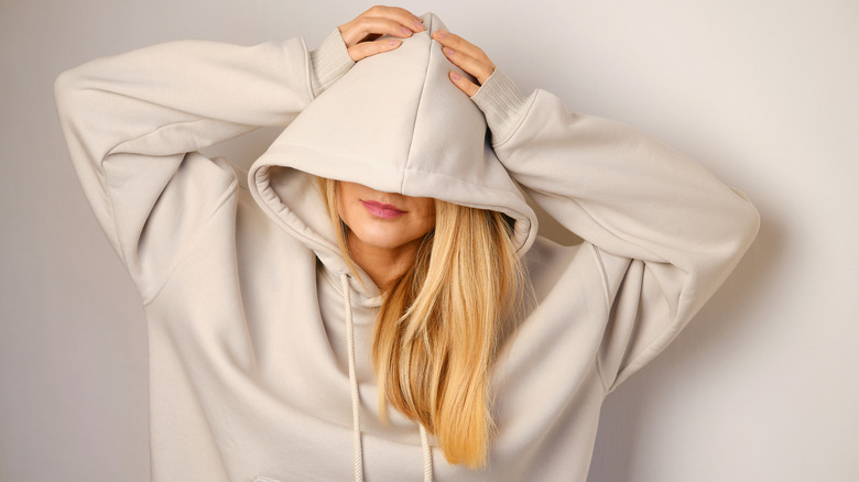 Woman in an oversized hoodie