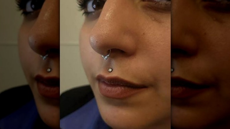 Person with dermal piercing above her lip